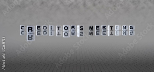 creditors meeting word or concept represented by black and white letter cubes on a grey horizon background stretching to infinity