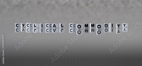 cyclical commodity word or concept represented by black and white letter cubes on a grey horizon background stretching to infinity