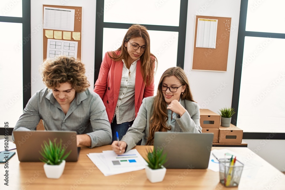 Group of business workers working at the office. Group of business workers working at the office.