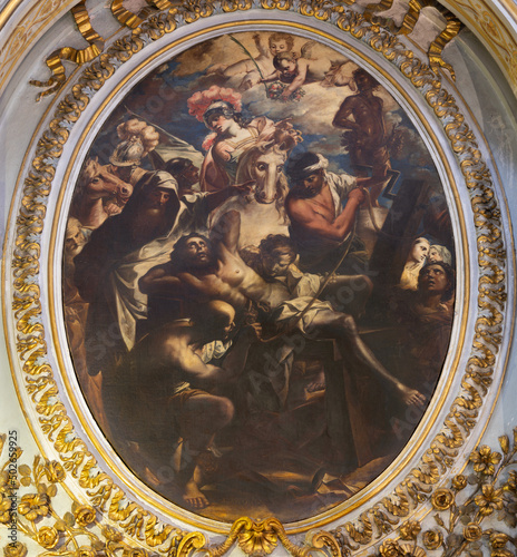 ROME, ITALY - AUGUST 28, 2021: The painting of martyrdom of St Erasmus in the church Chiesa San Paolo alla Regola by Biagio Puccini (1675-1713). photo