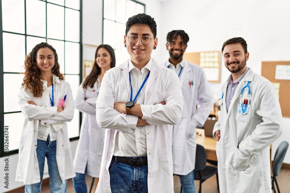 Group of young doctor smiling happy standing with arms crossed gesture at the clinic office. Group of young doctor smiling happy standing with arms crossed gesture at the clinic office.