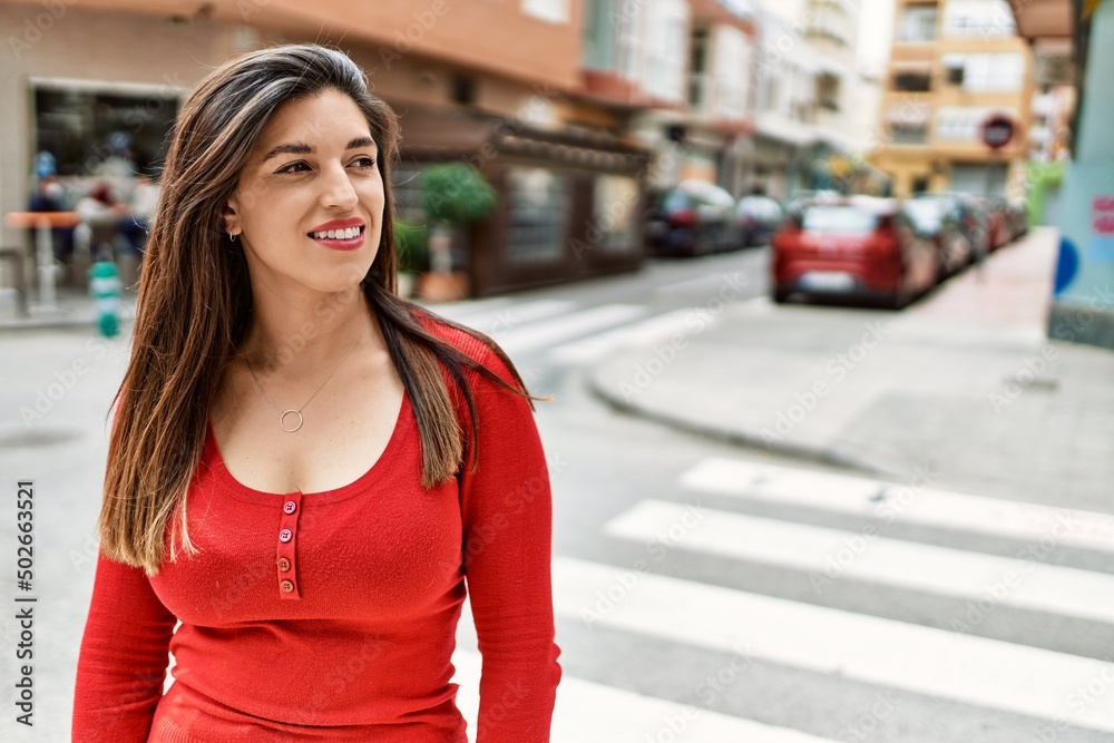 Young hispanic girl smiling happy standing at the city. Young hispanic girl smiling happy standing at the city.