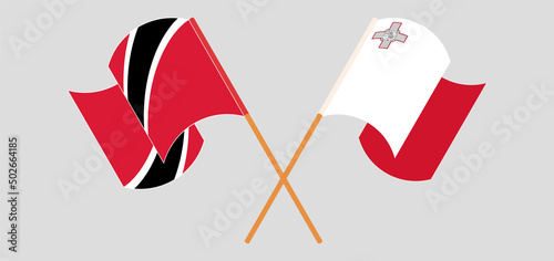 Crossed and waving flags of Trinidad and Tobago and Malta
