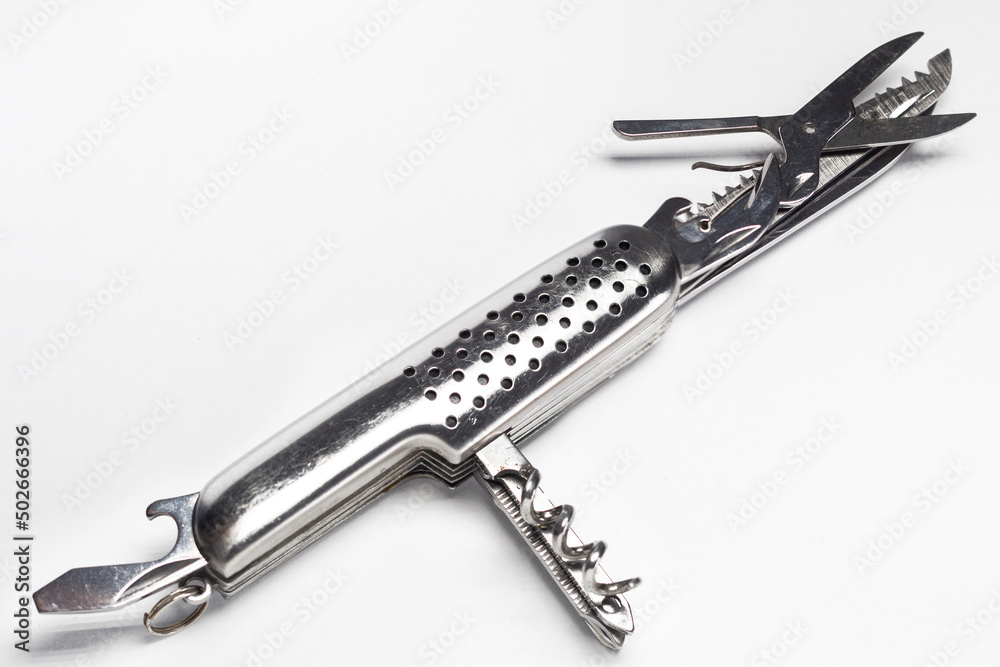 Open silver multifunction knife on white background Open silver multifunction knife on white background