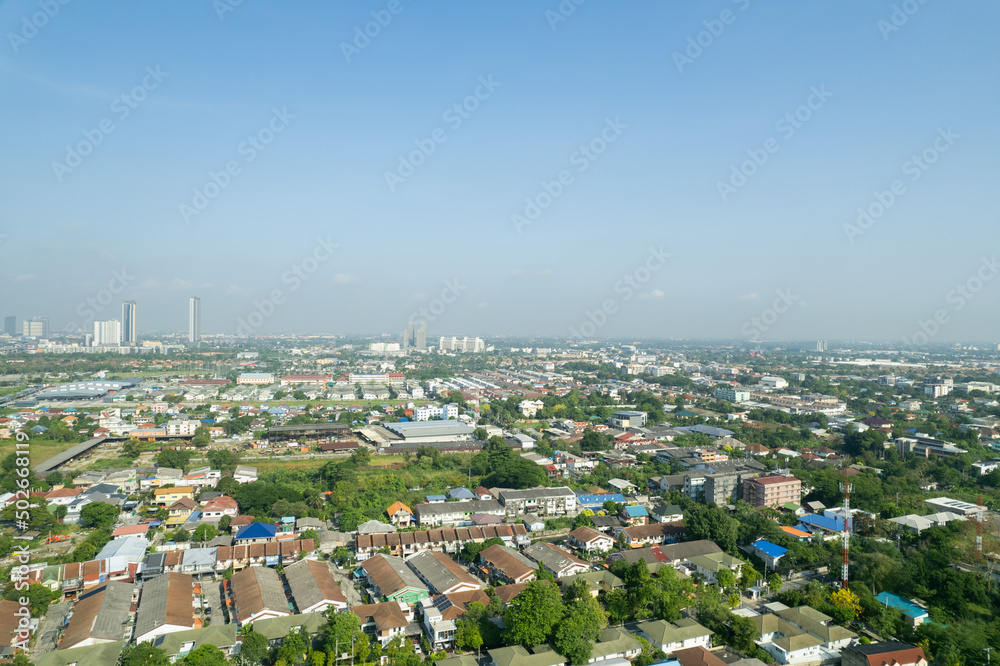Fototapeta premium Aerial view of the roof of a house with a car taken by a drone, top view of road