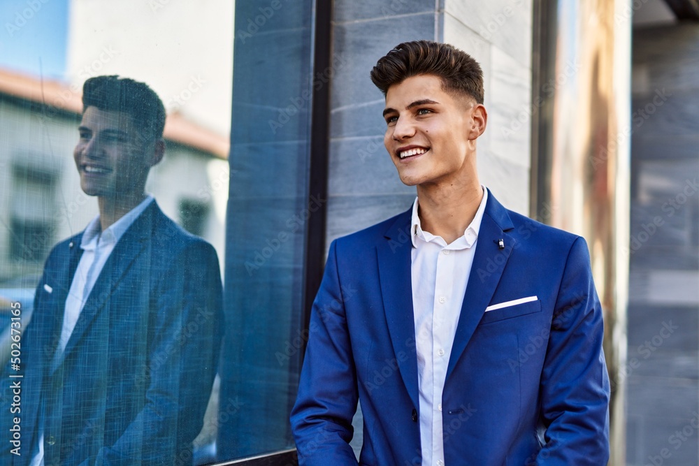 Young man smiling confident wearing suit at street