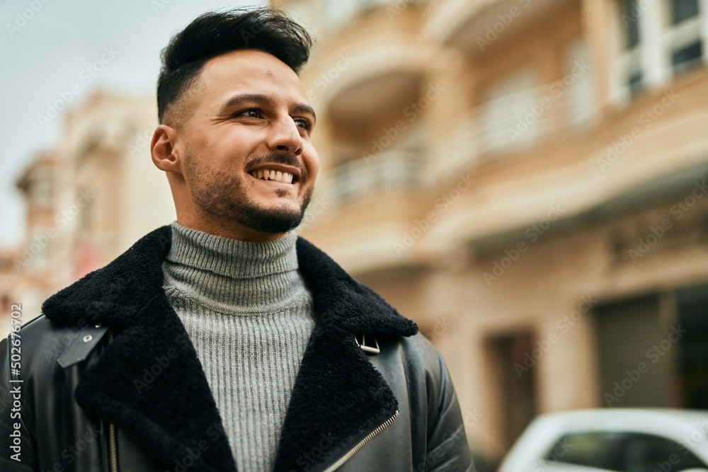 Young arab man smiling happy standing at the city. Young arab man smiling happy standing at the city.