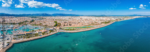 Aerial view of the highway near Palma de Mallorca and the beach in Spain. Road goes into the capital. © Aerial Film Studio