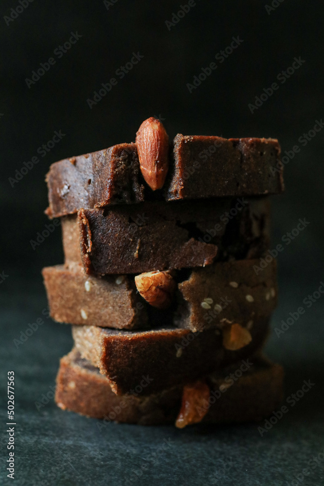 Homemade banana bread with walnut on dark background. Place for text, copy space. Homemade banana bread with walnut on dark background. Place for text, copy space.