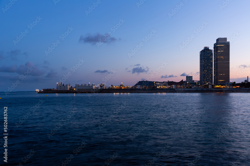 Picturesque evening view of Barcelona from Mediterranean sea, Spain