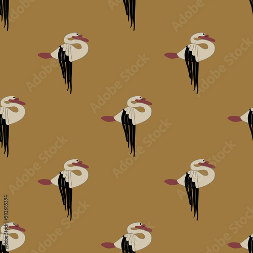 Seamless animal pattern with felt swans from Pazyryk. Scythian symbol from Siberia. Black and white birds with red beaks on yellow gold background. photo