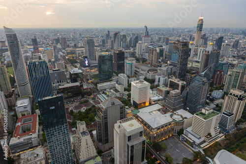 Aerial view of Ploenchit junction with cars traffic skyscraper buildings. Bangkok City in downtown at night  Thailand