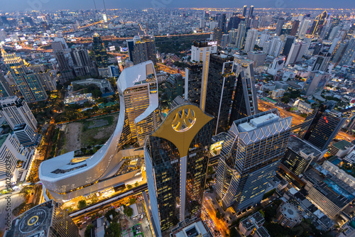 Aerial view of Ploenchit junction with cars traffic skyscraper buildings. Bangkok City in downtown at night, Thailand © Sathit Trakunpunlert
