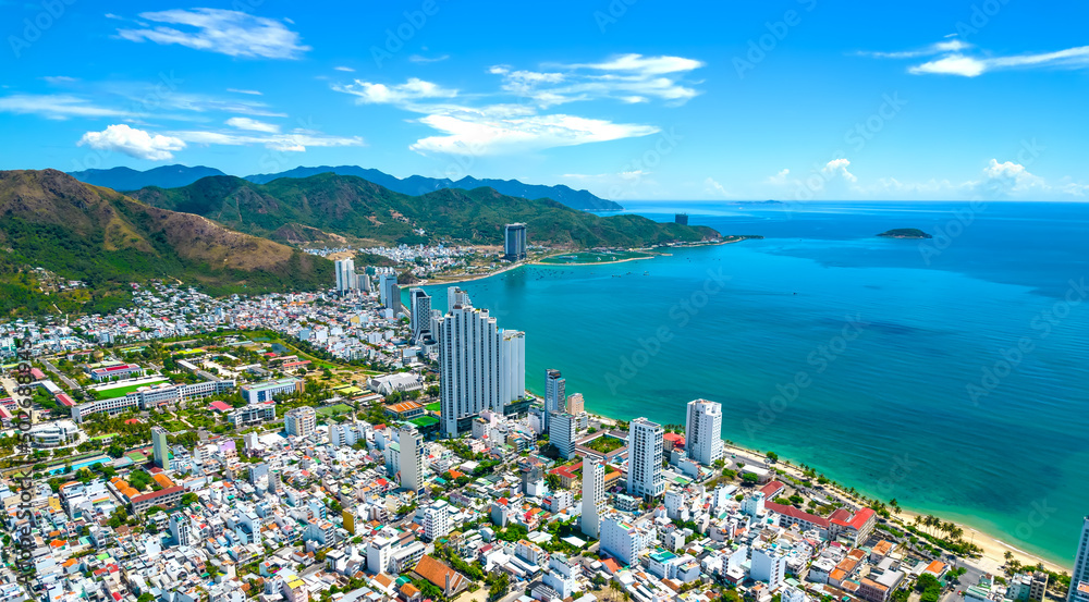The coastal city of Nha Trang seen from above on a sunny summer afternoon. This is a famous city for cultural tourism in central Vietnam