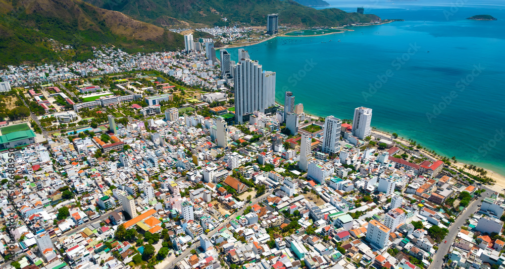 The coastal city of Nha Trang seen from above on a sunny summer afternoon. This is a famous city for cultural tourism in central Vietnam