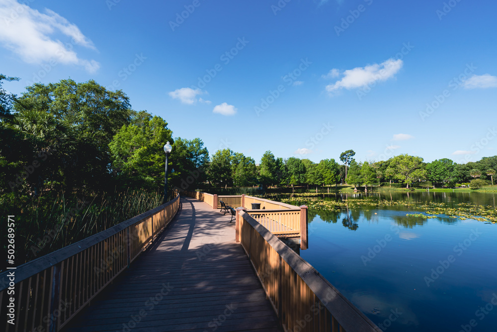 Lake Lily park boardwalk in downtown Maitland, a suburb of Orlando area in Florida