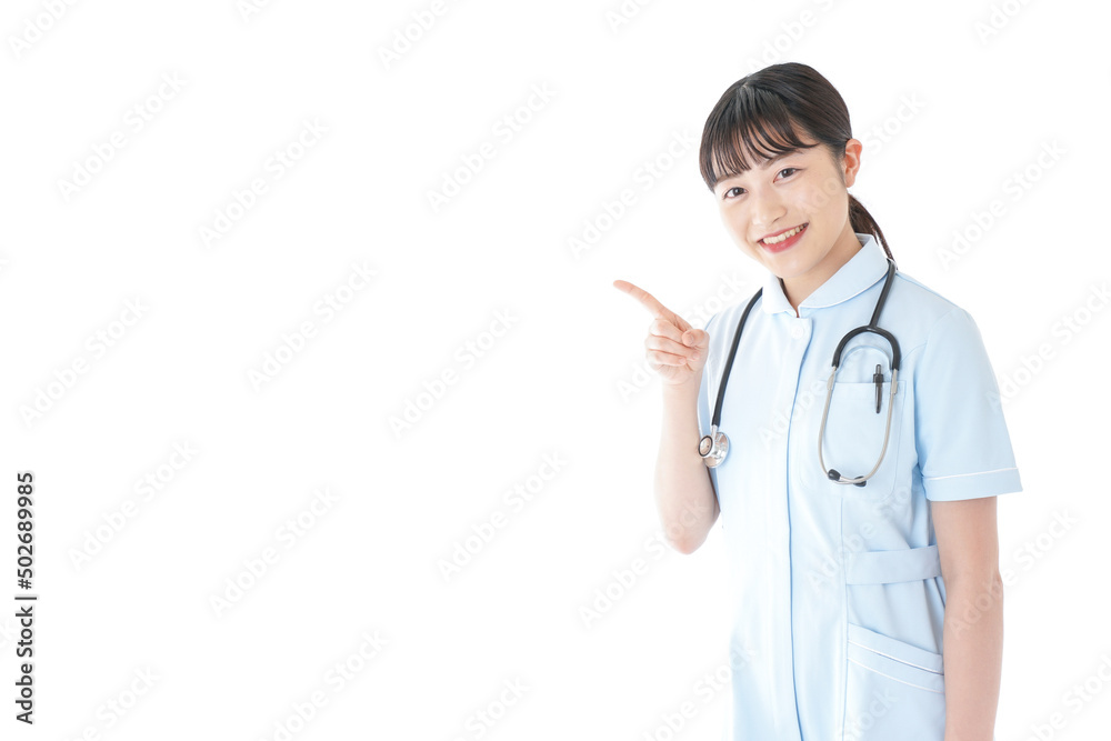 Young nurse pointing at something Young nurse pointing at something