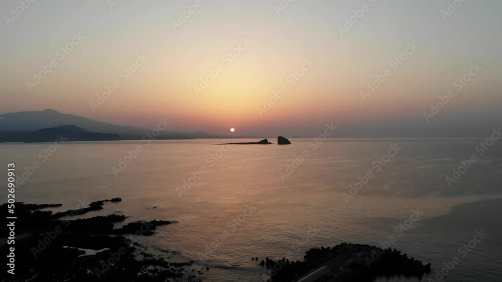 The sunrise of Hallasan Mountain and Brother Island as seen from Songaksan Mountain in Jeju Island, South Korea, The sunrise of Hallasan Mountain and Brother Island as seen from Songaksan Mountain in Jeju Island, South Korea,