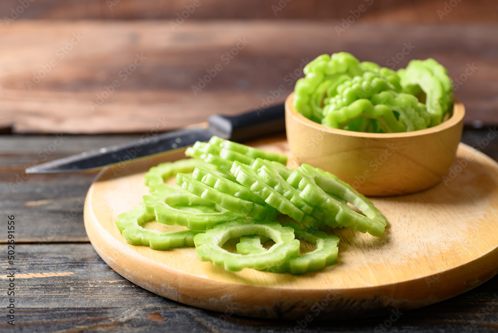 Sliced bitter melon or bitter gourd, Asian organic vegetables Sliced bitter melon or bitter gourd, Asian organic vegetables