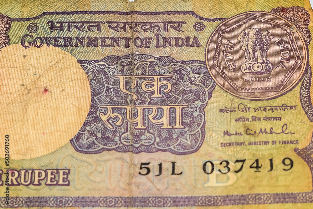 Fototapeta premium Old One Rupee notes combined on the table, India money on the rotating table. Old Indian Currency notes on a rotating table, Indian Currency on the table