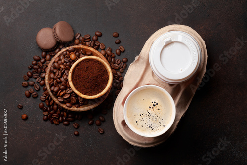 Takeaway cups, roasted coffee beans and ground coffee