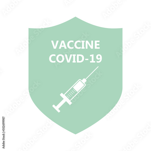Syringe with a vaccine against the background of a shield