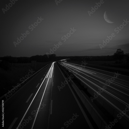 highway with light traces of cars in a long time exposure