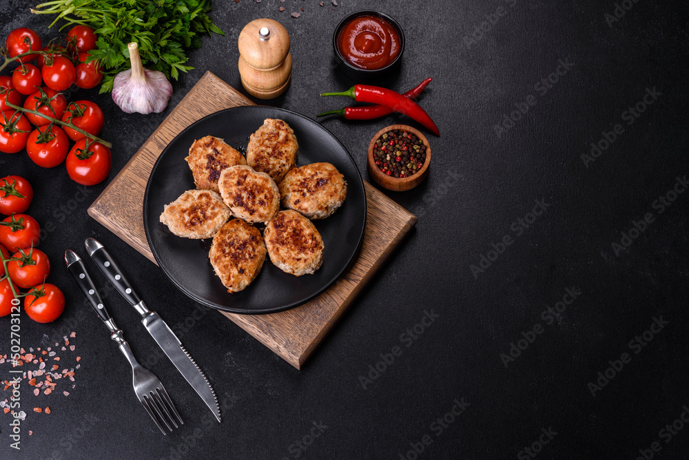 Delicious fresh fried minced meat patties on a dark concrete background Delicious fresh fried minced meat patties on a dark concrete background
