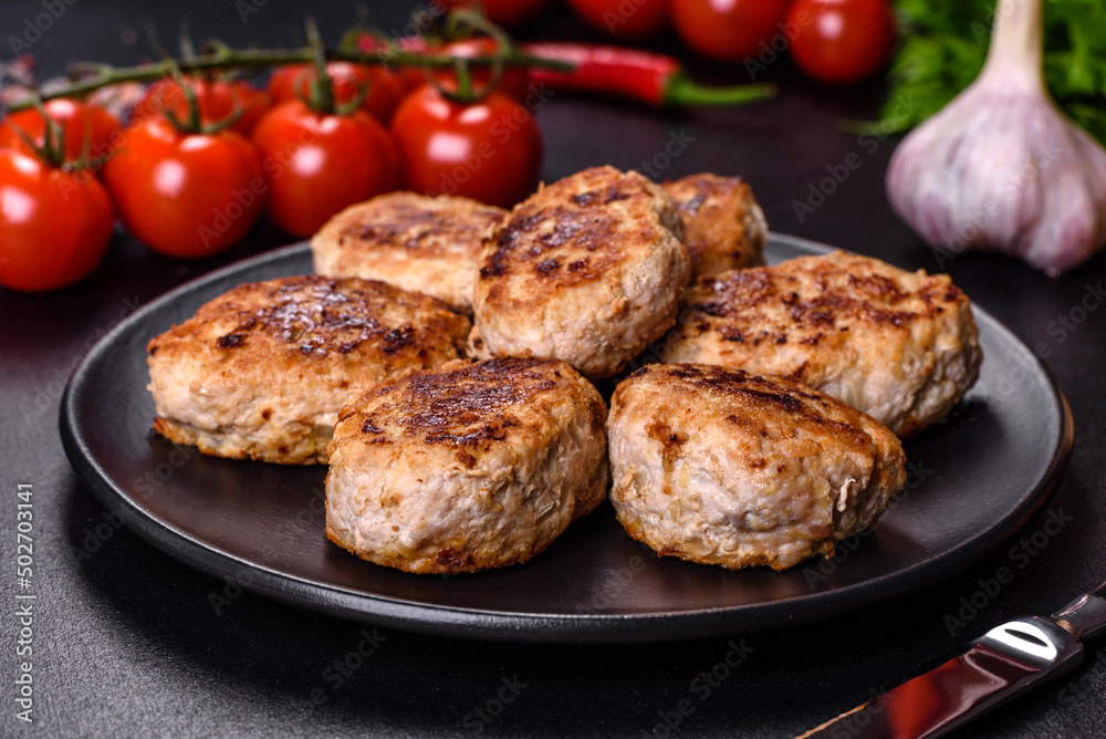 Delicious fresh fried minced meat patties on a dark concrete background Delicious fresh fried minced meat patties on a dark concrete background