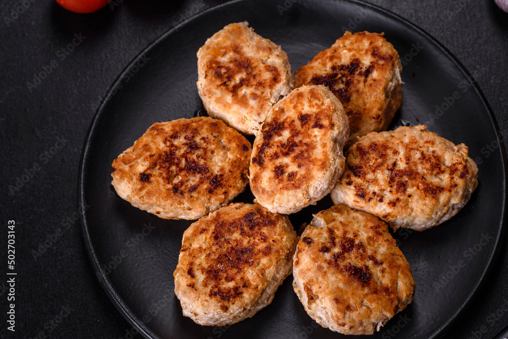 Delicious fresh fried minced meat patties on a dark concrete background Delicious fresh fried minced meat patties on a dark concrete background
