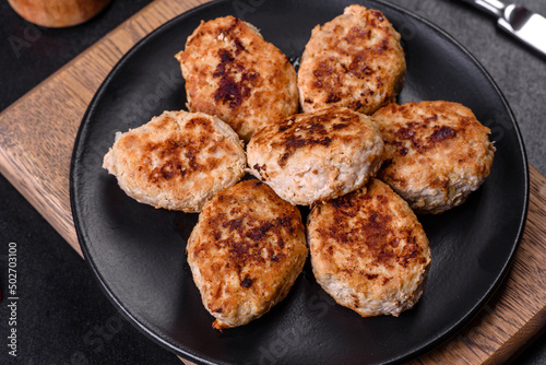 Delicious fresh fried minced meat patties on a dark concrete background