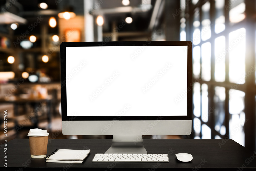Computer Monitor, Keyboard, coffee cup smartphone, tablet, and Mouse with Blank or White Screen Isolated is on the work table in the coffeeshop .. Computer Monitor, Keyboard, coffee cup smartphone, tablet, and Mouse with Blank or White Screen Isolated is on the work table in the coffeeshop ..
