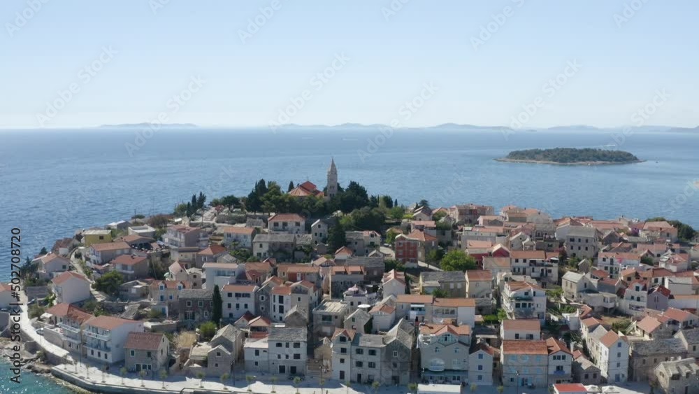 An aerial drone shot looking over the coast of Hvar, Croatia. Featuring boats, buildings, islands and the beautiful ocean. An aerial drone shot looking over the coast of Hvar, Croatia. Featuring boats, buildings, islands and the beautiful ocean.