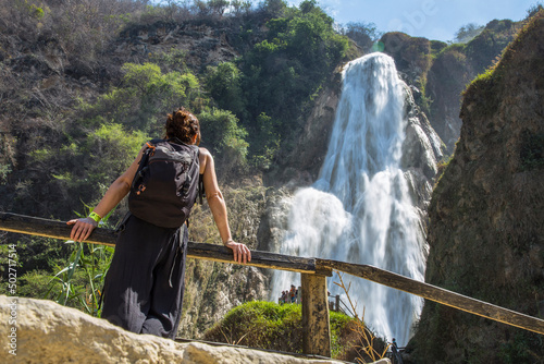 A woman in Bridal veil waterfall at the Chiflón waterfalls, Mexico photo