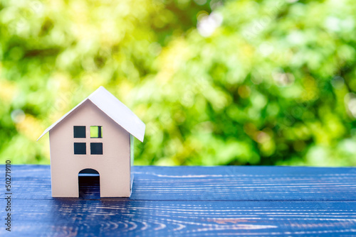 The symbol of the house on a natural green background