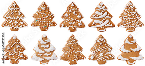 A set of gingerbread cookies in the form of Christmas trees. Various decorations made of sugar glaze. Isolated on white background.