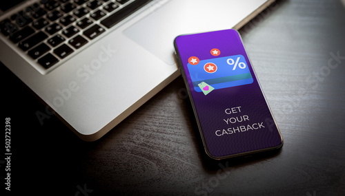 Cashback loyalty program concept. Customer rewards and money refund service. Smartphone with discount card with rewarding marketing points on the screen and text - get your cashback.