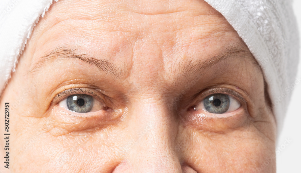Fototapeta premium Closeup view of eyes of senior woman