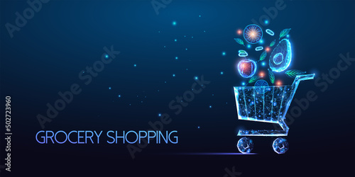 Futuristic online grocery shopping concept with glowing shopping cart full of fruits and vegetables