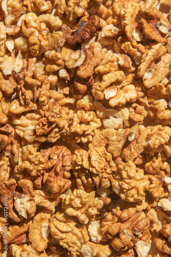 Peeled walnuts top view. Food abstract background with nuts Peeled walnuts top view. Food abstract background with nuts
