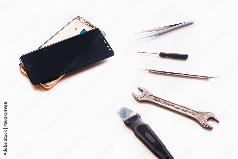 Flat lay image of dismantling the broken smart phone for preparing to repair or replace some components. isolated Flat lay image of dismantling the broken smart phone for preparing to repair or replace some components. isolated