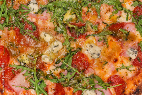 Background of pizza with meat products, top view close-up