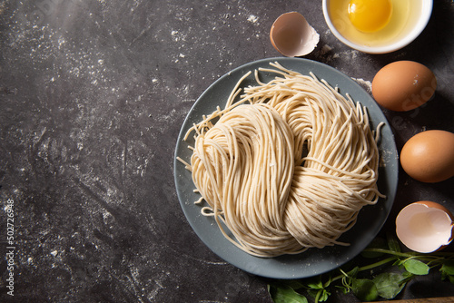 Handmade Noodles.raw egg noodles on board. photo