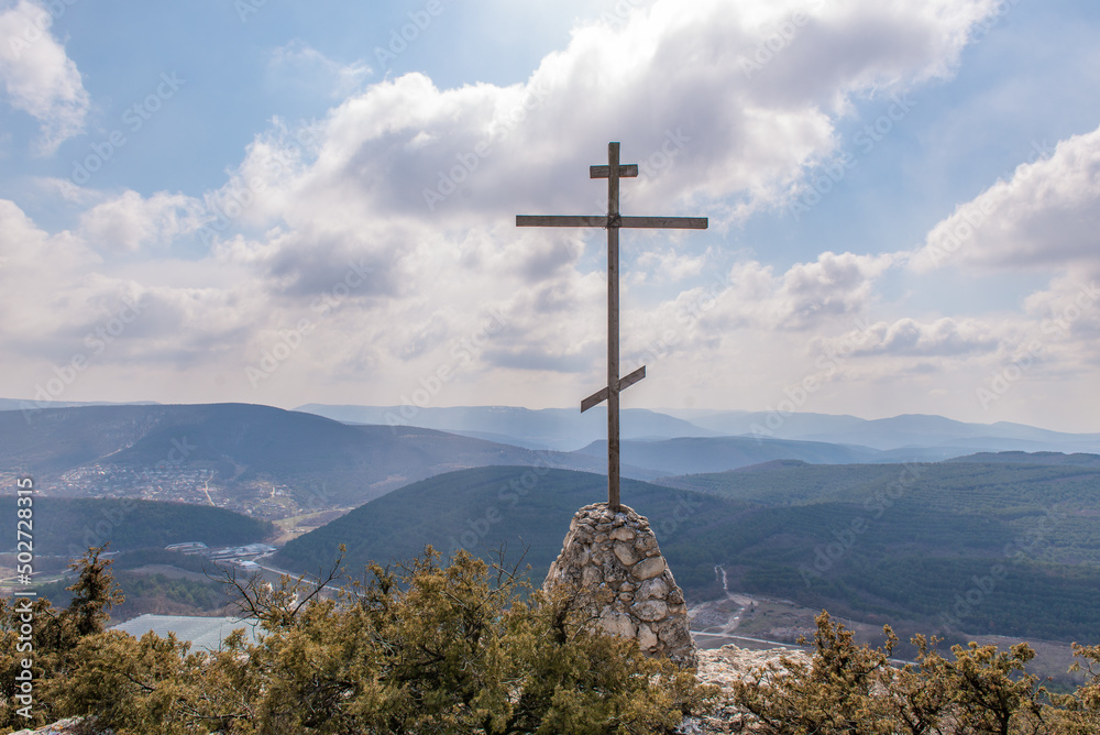 Cross on the mountain above the Chelter-Marmara cave monastery in Crimea