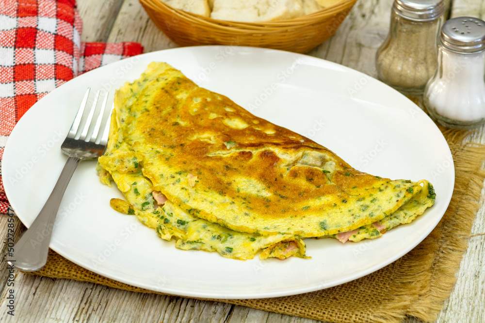 ham and herb omelet on a plate