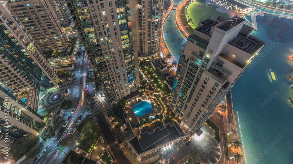 Skyscrapers skyline look down perspective in Dubai Downtown in the evening aerial timelapse. Skyscrapers skyline look down perspective in Dubai Downtown in the evening aerial timelapse.