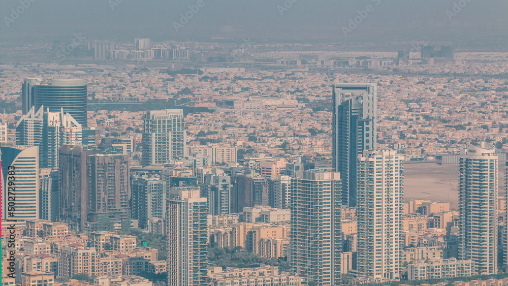 Dubai Aerial view showing al barsha heights and greens district area timelapse
