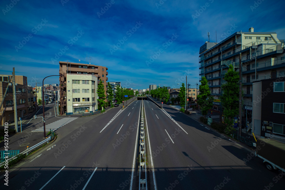 A downtown street at Kanpachi avenue in Tokyo wide shot
