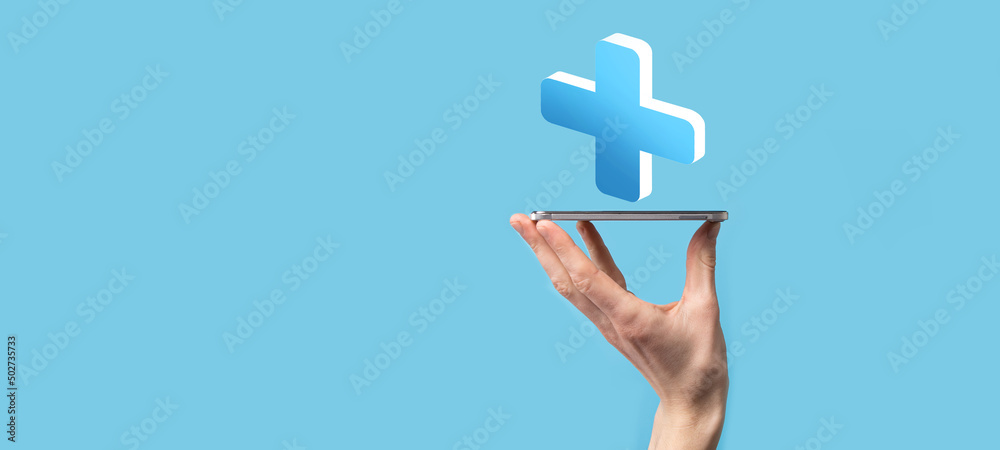 Businessman hold 3D plus icon, man hold in hand offer positive thing such as profit, benefits, development, CSR represented by plus sign.The hand shows the plus sign Businessman hold 3D plus icon, man hold in hand offer positive thing such as profit, benefits, development, CSR represented by plus sign.The hand shows the plus sign