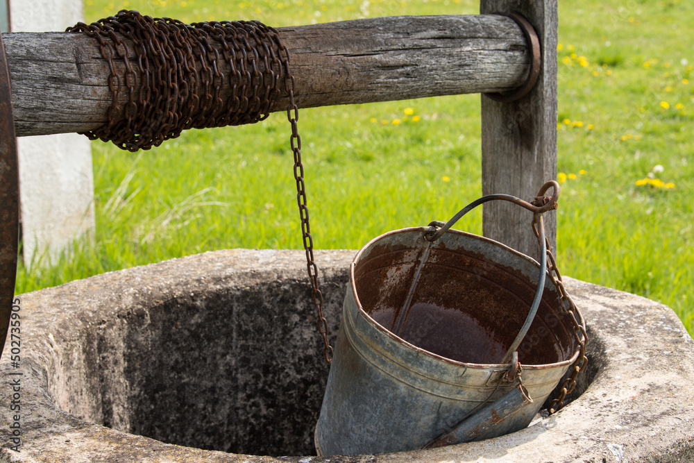 Croatia, May 01,2022: Well for drawing water located in the countryside. Croatia, May 01,2022: Well for drawing water located in the countryside.